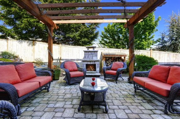 patio complete with overhead pergola is built and fully furnished by Mandurah Landscaping